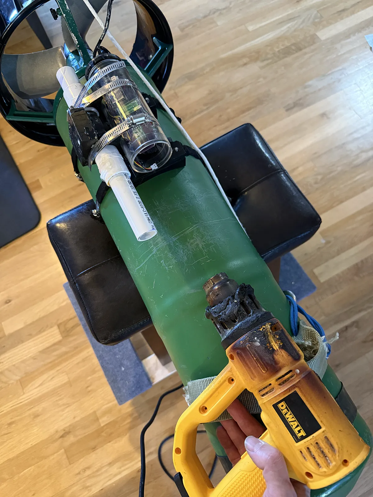 Setup with scooter on the bench, heating with a well-worn heat gun