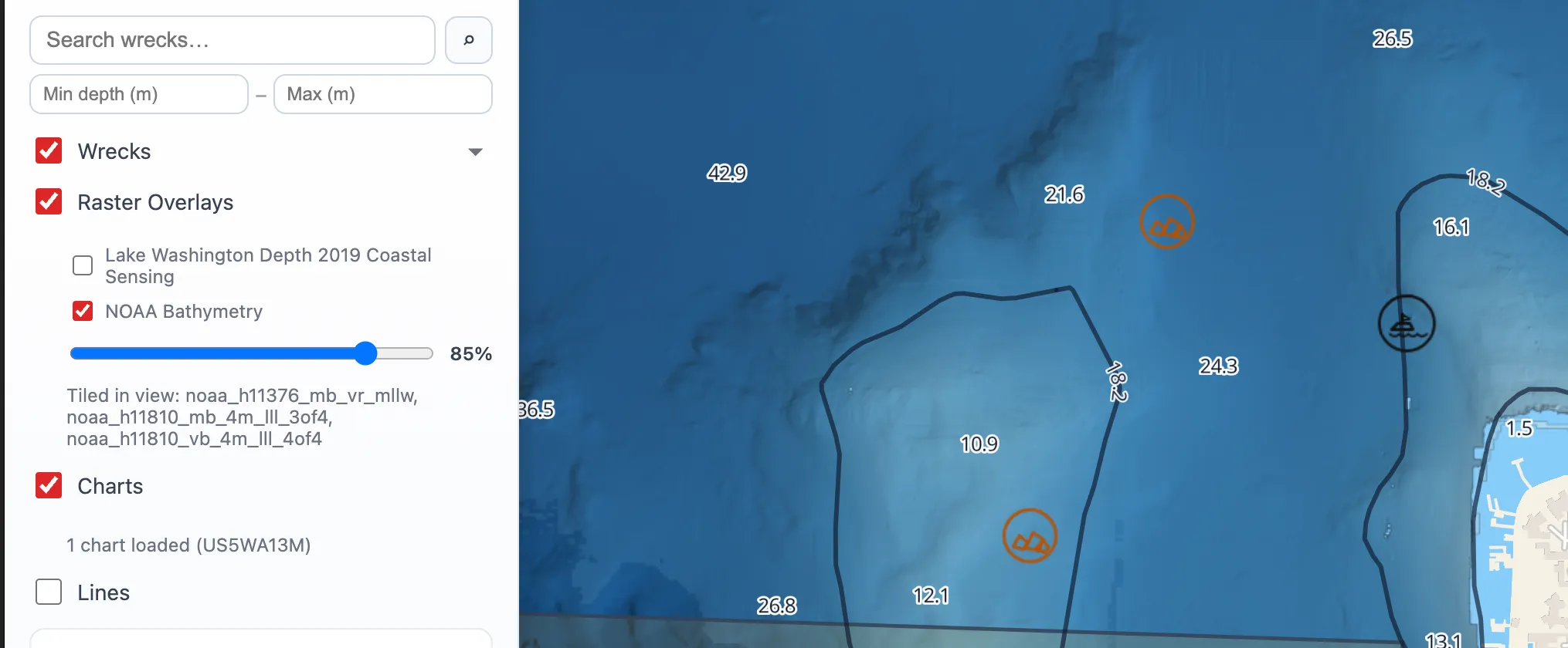 The layer panel beside a chart view — wrecks, NOAA bathymetry at 85 per cent and charts each on their own toggle, with the tiles in view named